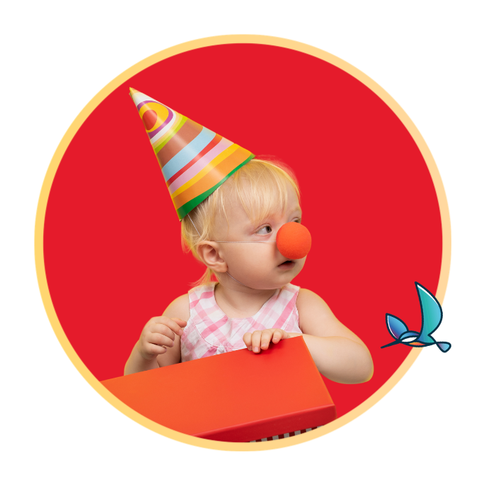 An infant child wearing a clown hat and nose
