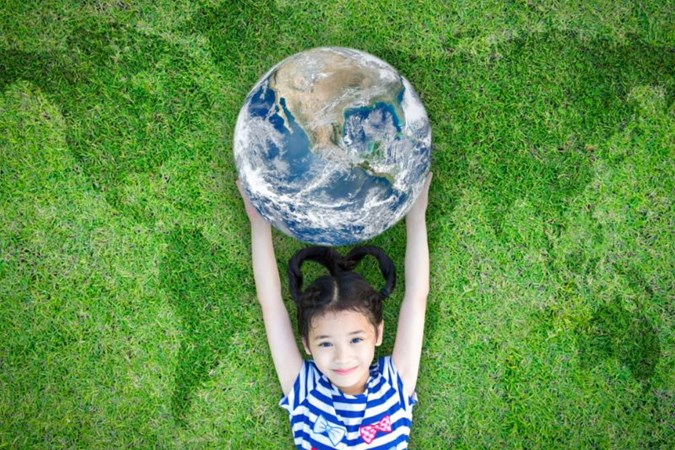 A child holding a globe