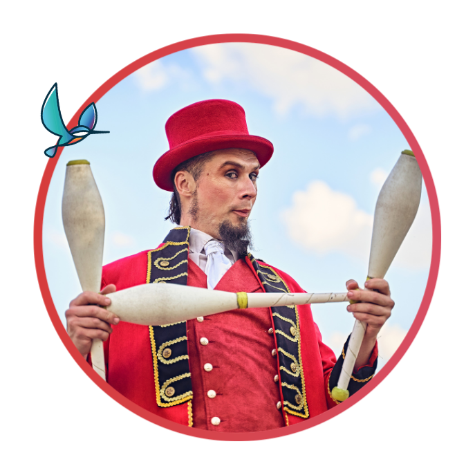 Juggler holding batons dressed in traditional circus attire