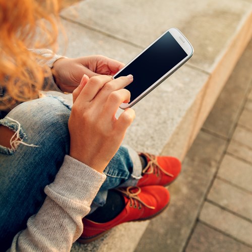 Shutterstock 217498456 Girl On Mobile
